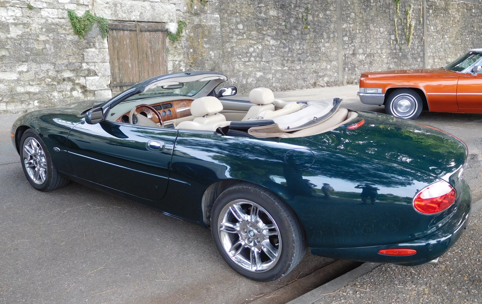 Luxury convertible with wooden dashboard and chrome wheels
