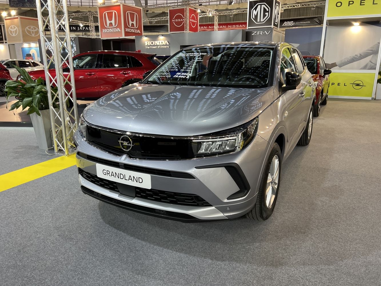 Modern headlights and bold front grille on a 2022 SUV
