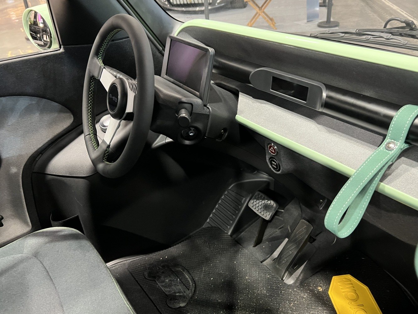 Minimalist dashboard with digital display and modern steering wheel