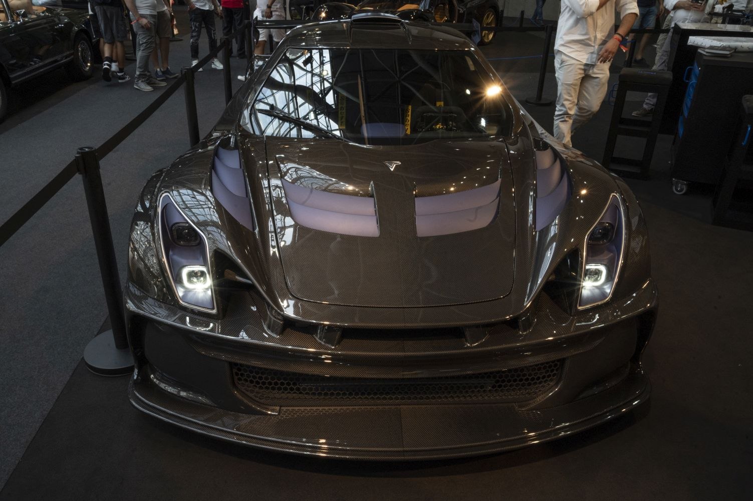Sleek carbon fiber front with aerodynamic vents and LED headlights