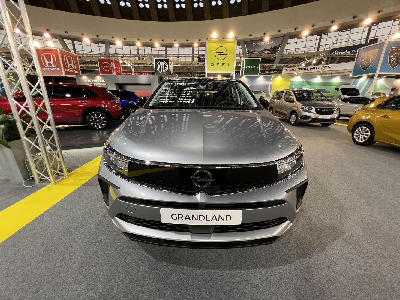 Bold front grille and sharp LED headlights of a silver SUV