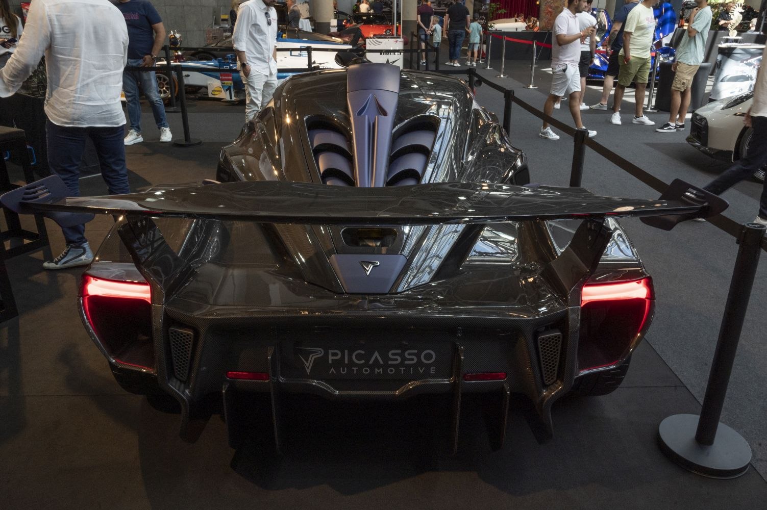 Rear view with large aerodynamic wing and distinctive taillights