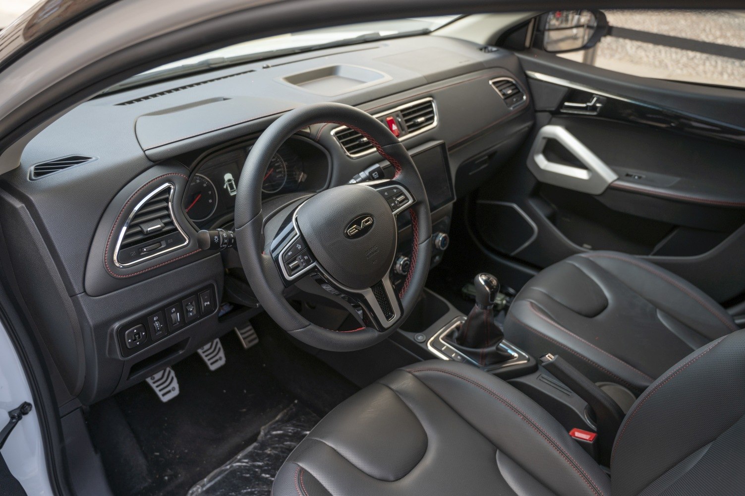 Dashboard and steering wheel with manual gear shift and pedals