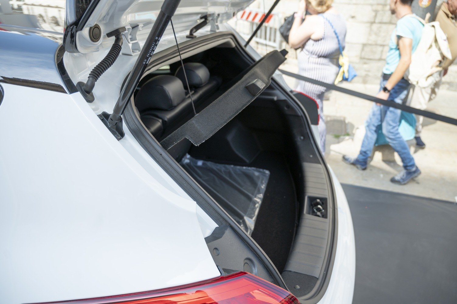 Open trunk showing spacious rear cargo area with visible seats