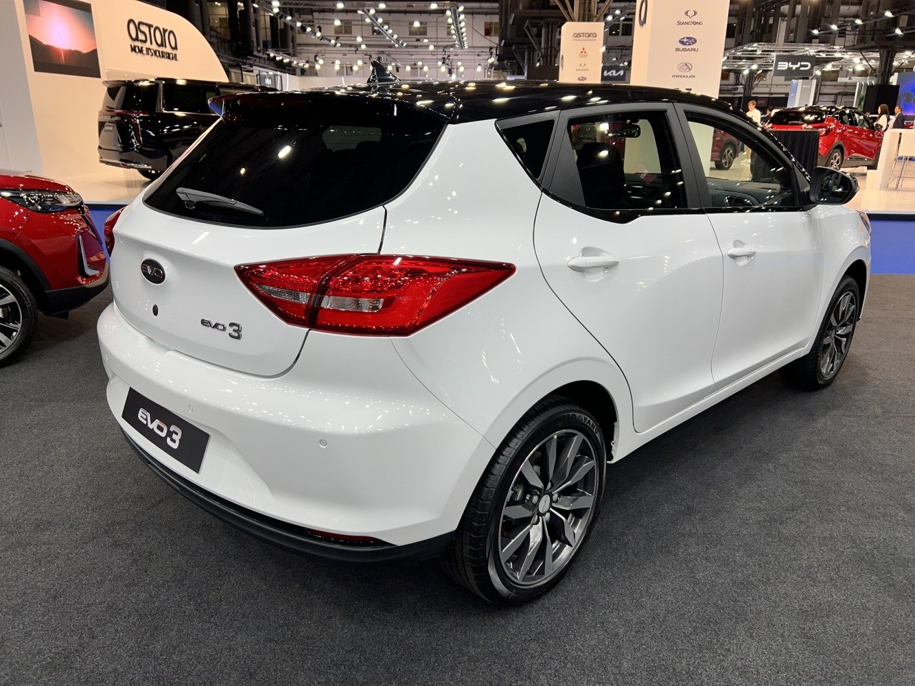 Rear and side view of compact hatchback with sharp taillights and alloy wheels