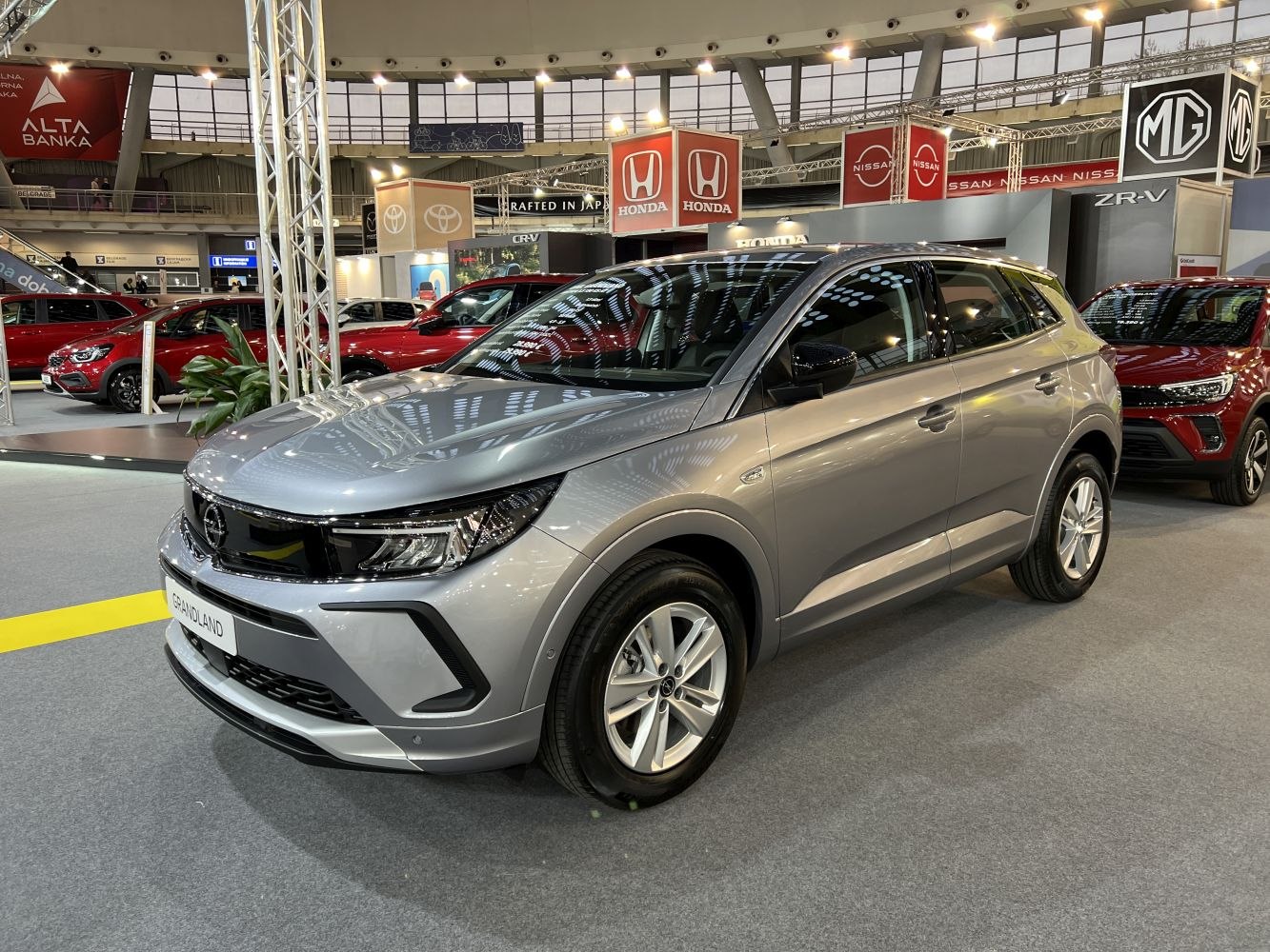 Silver compact SUV front and side view with LED headlights and alloy wheels