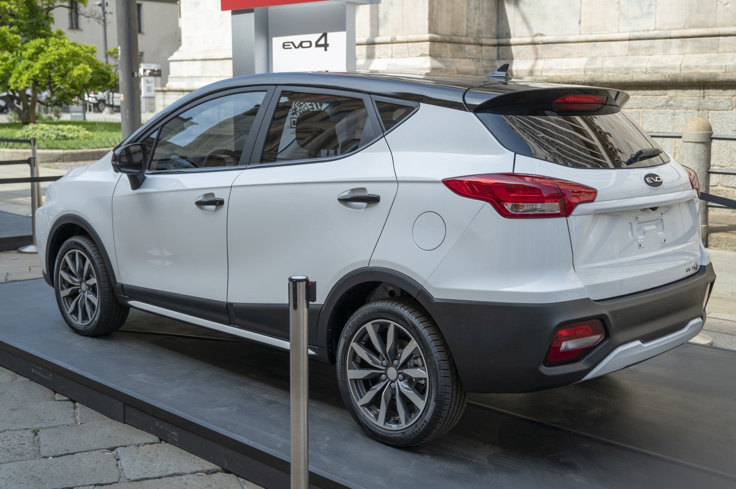 Rear and side view of white SUV with modern taillights and alloy wheels