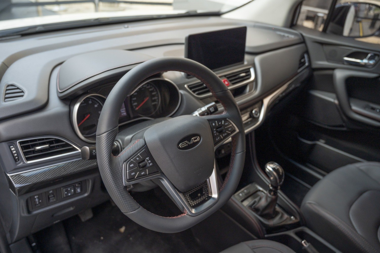 Modern steering wheel and digital dashboard with center screen