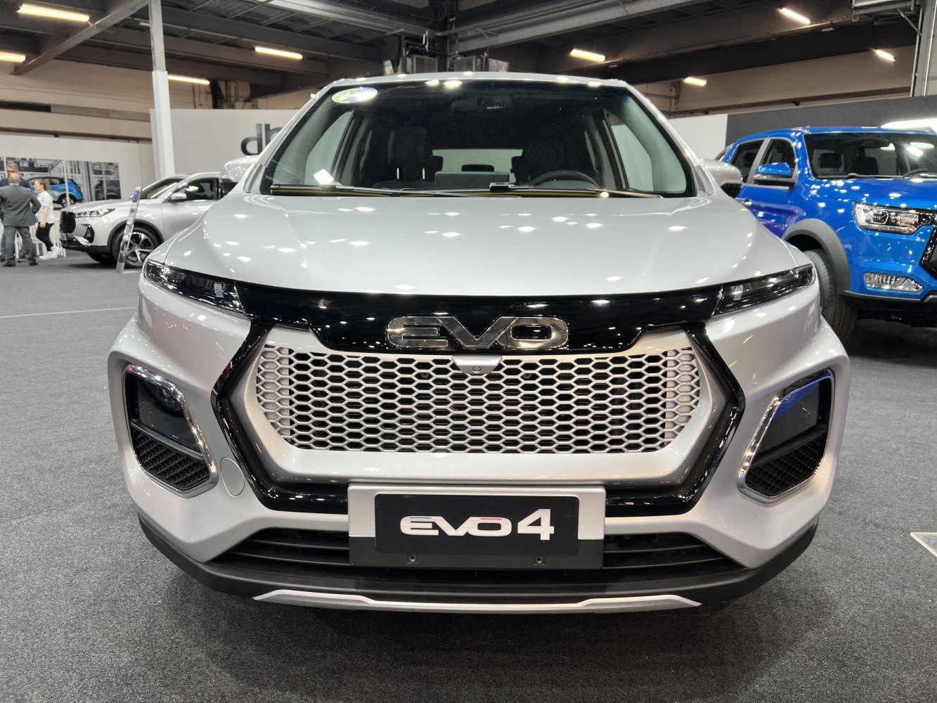 Front honeycomb grille and sleek headlights of modern SUV front fascia