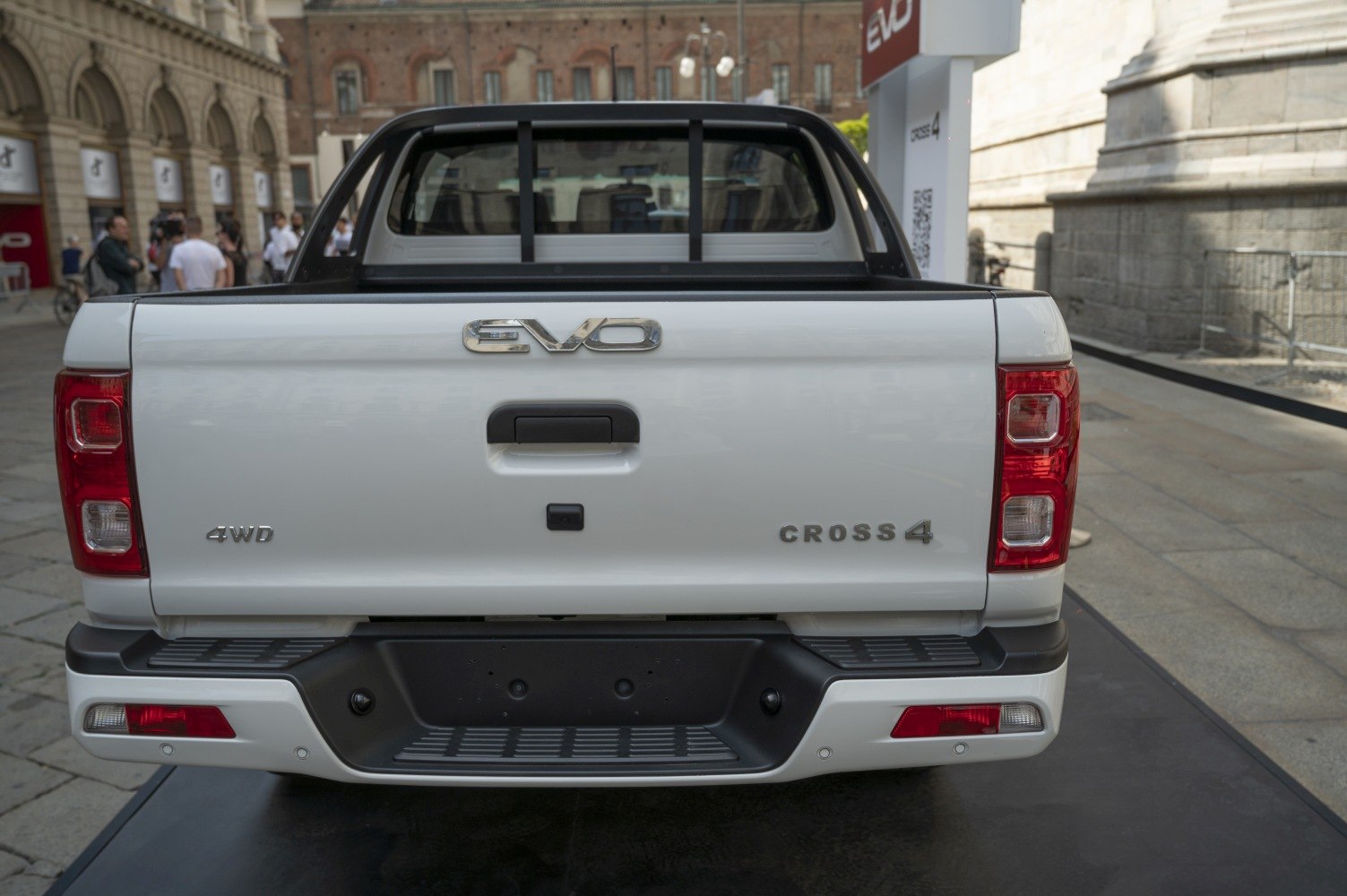 Rear view of a pickup truck with tailgate, 4WD badge, and red rear lights.
