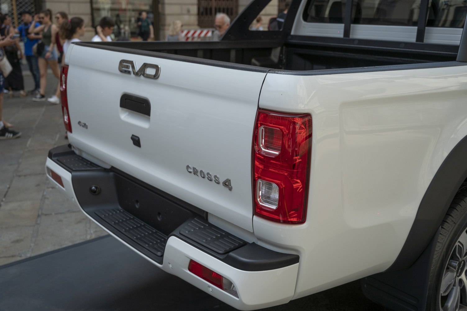 Pickup truck rear tailgate, taillights, and bumper details.