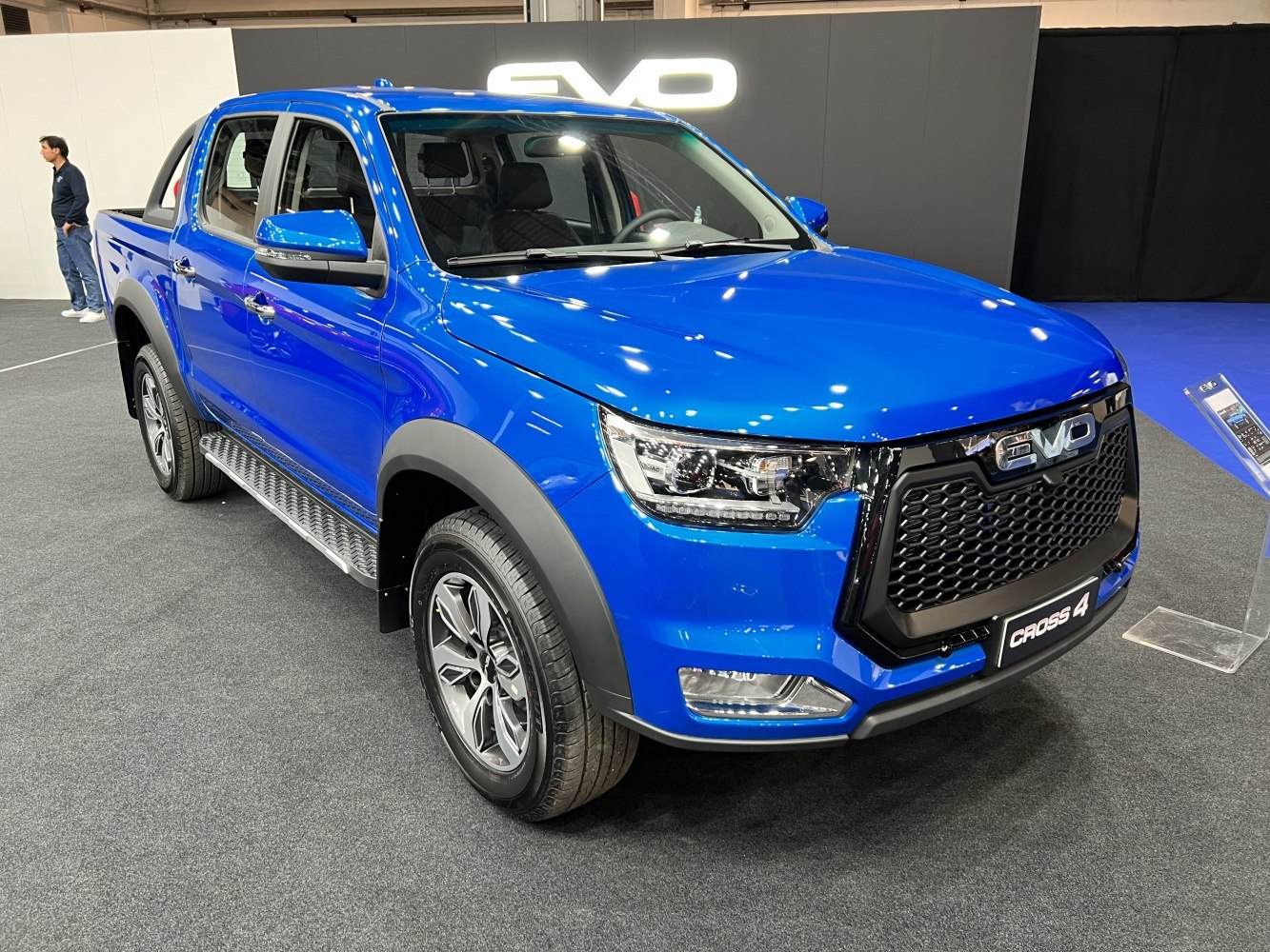 Blue pickup with bold grille and LED headlights