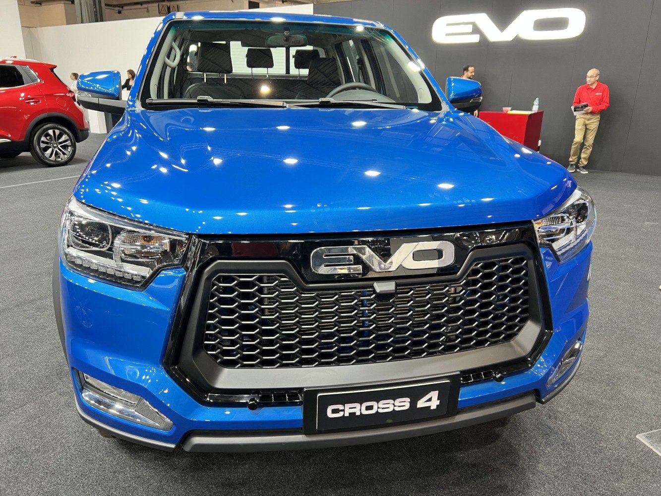 Close-up of front grille and headlights on blue pickup
