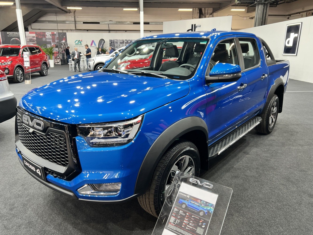 Blue pickup truck with bold front grille and LED headlights