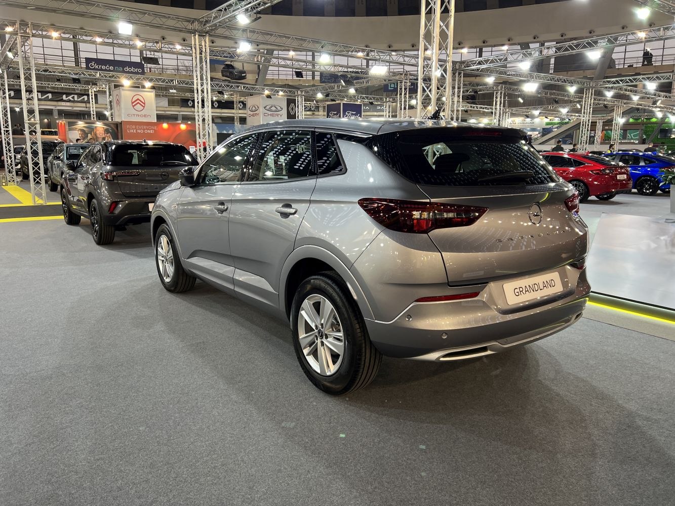 Silver SUV rear and side view at automotive exhibition