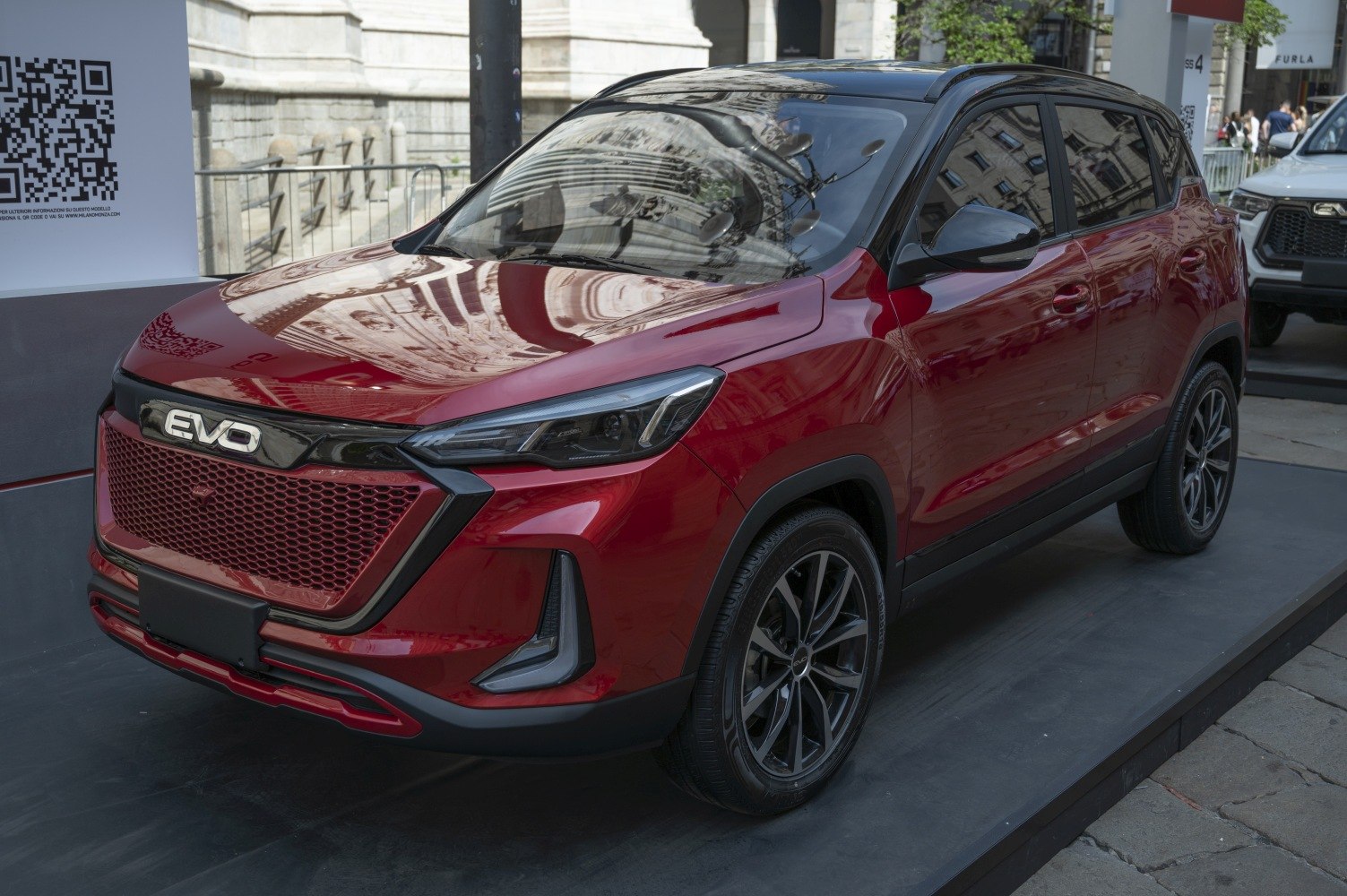 Front grille and LED headlights on a sleek modern SUV with black roof.
