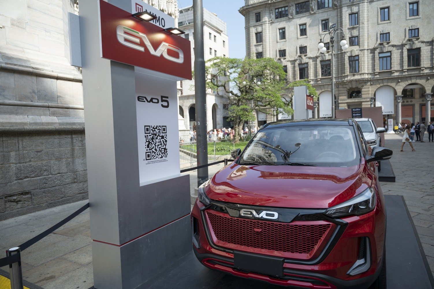 Bold grille and sleek headlights on a red SUV front view