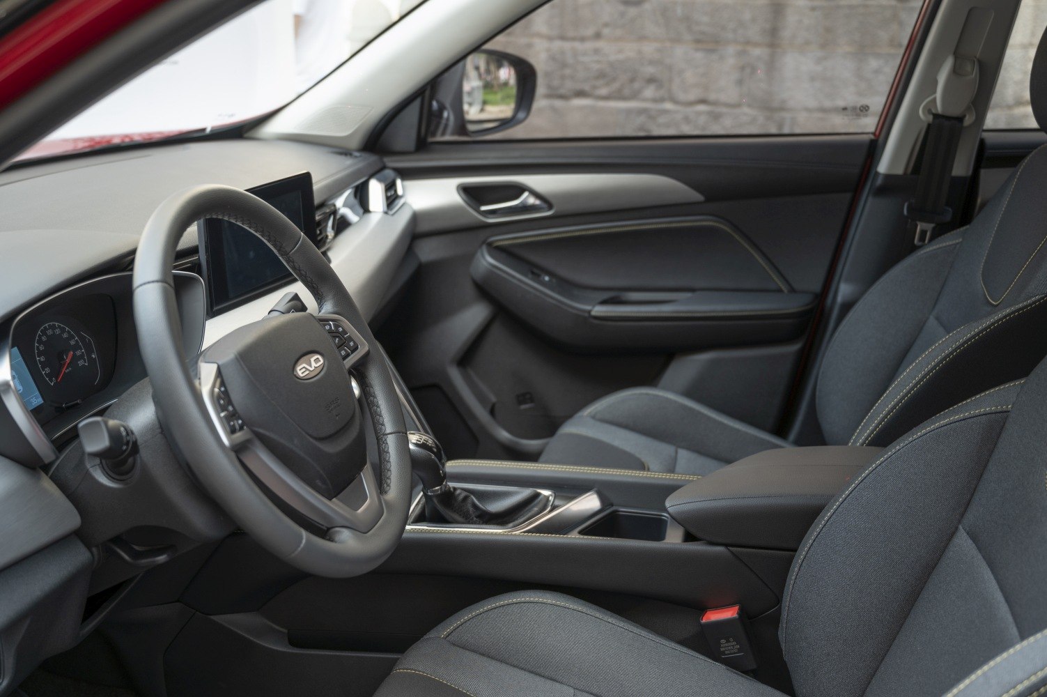 Modern steering wheel and digital dashboard with ergonomic interior design