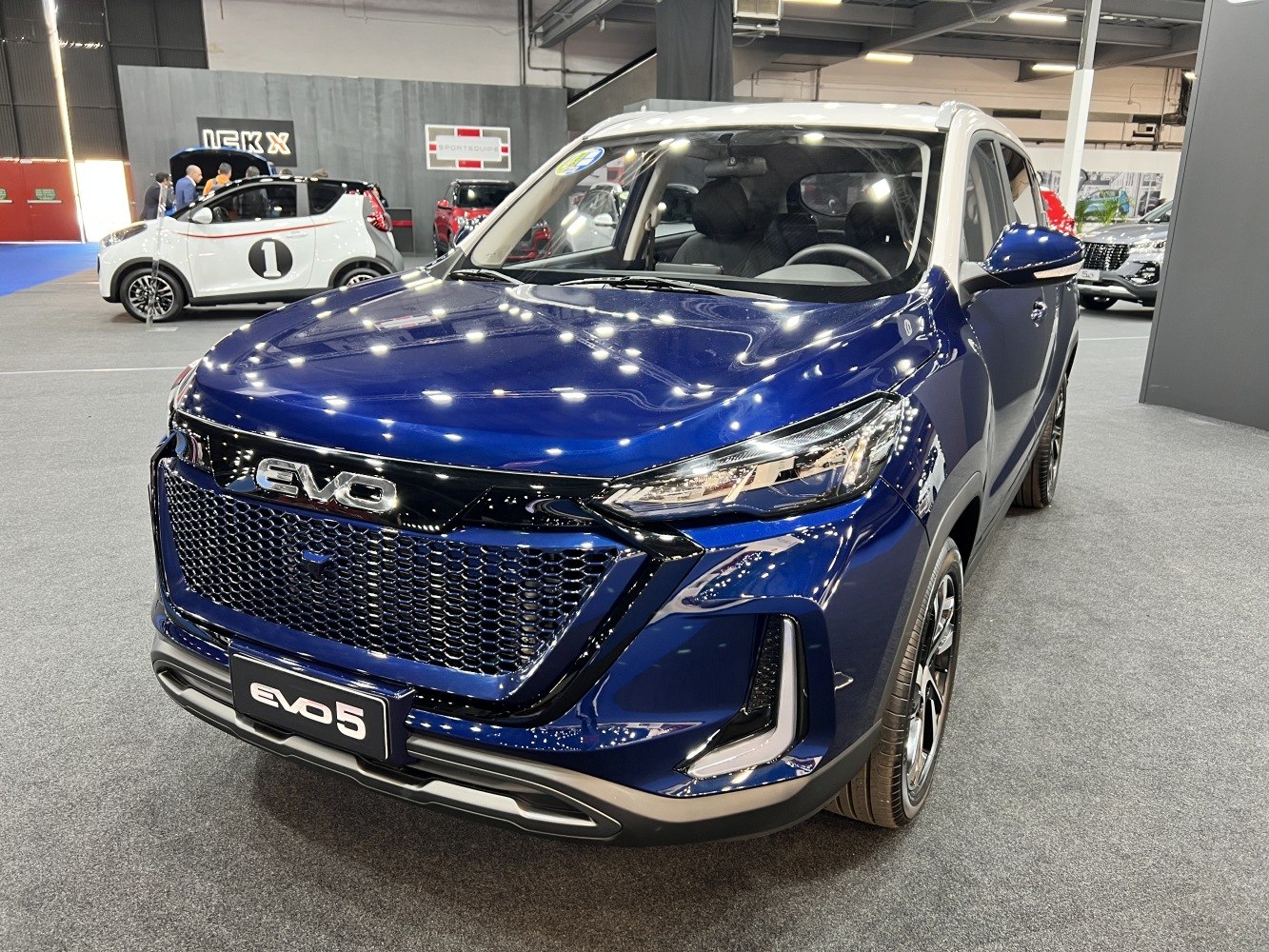 Detailed honeycomb front grille and sleek headlights of a modern SUV