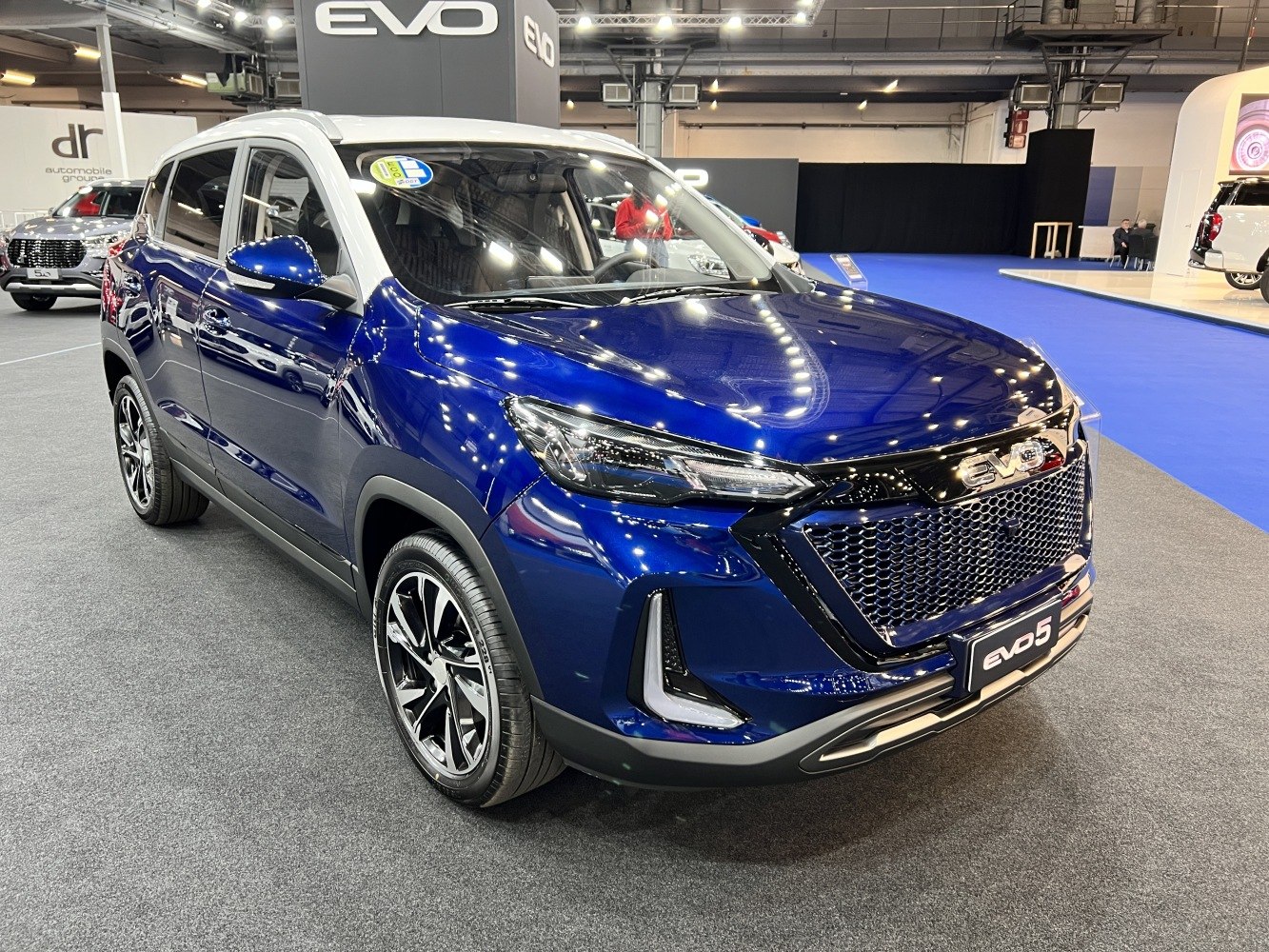Front-side view with LED headlights and mesh grille