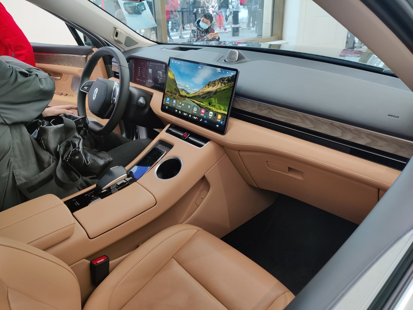 Large touchscreen and tan leather interior with digital instrument cluster