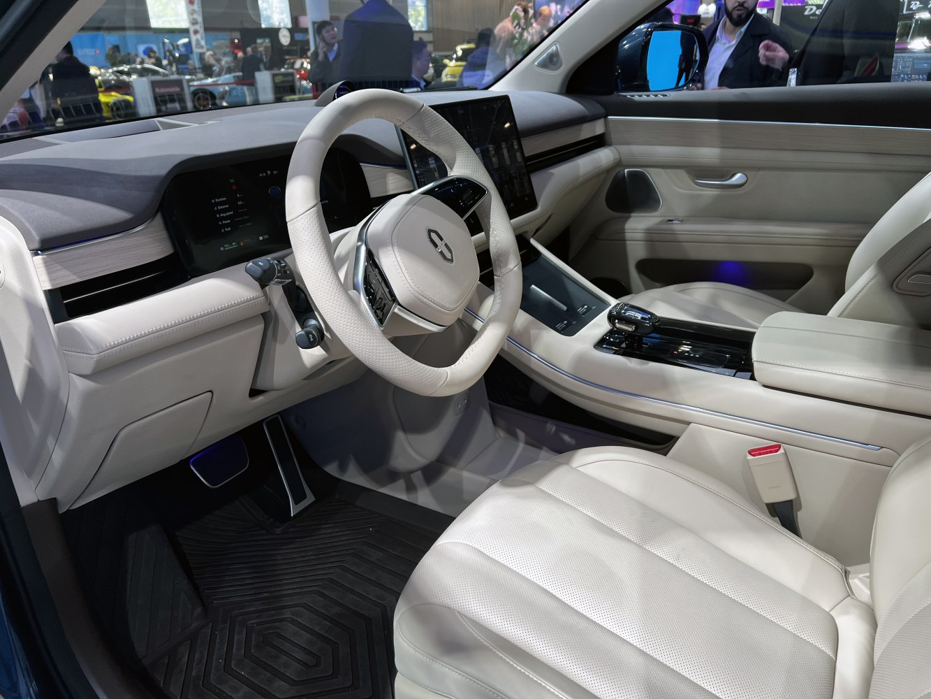 Modern dashboard and steering wheel with digital displays in luxury car interior