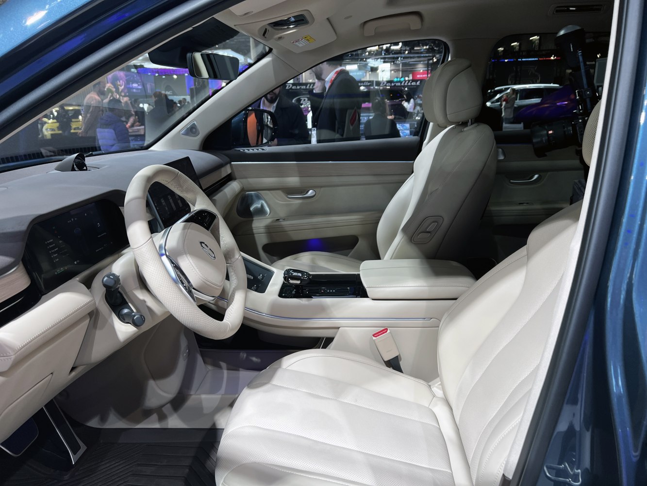 Plush beige leather seats and digital dashboard with modern center console.
