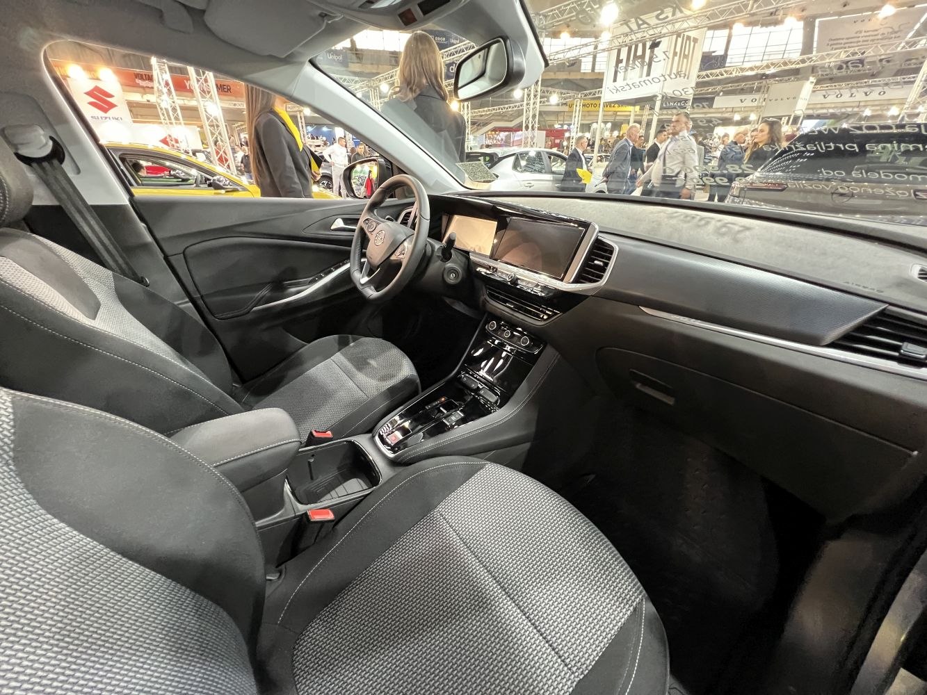 Modern interior and dashboard layout with fabric seats