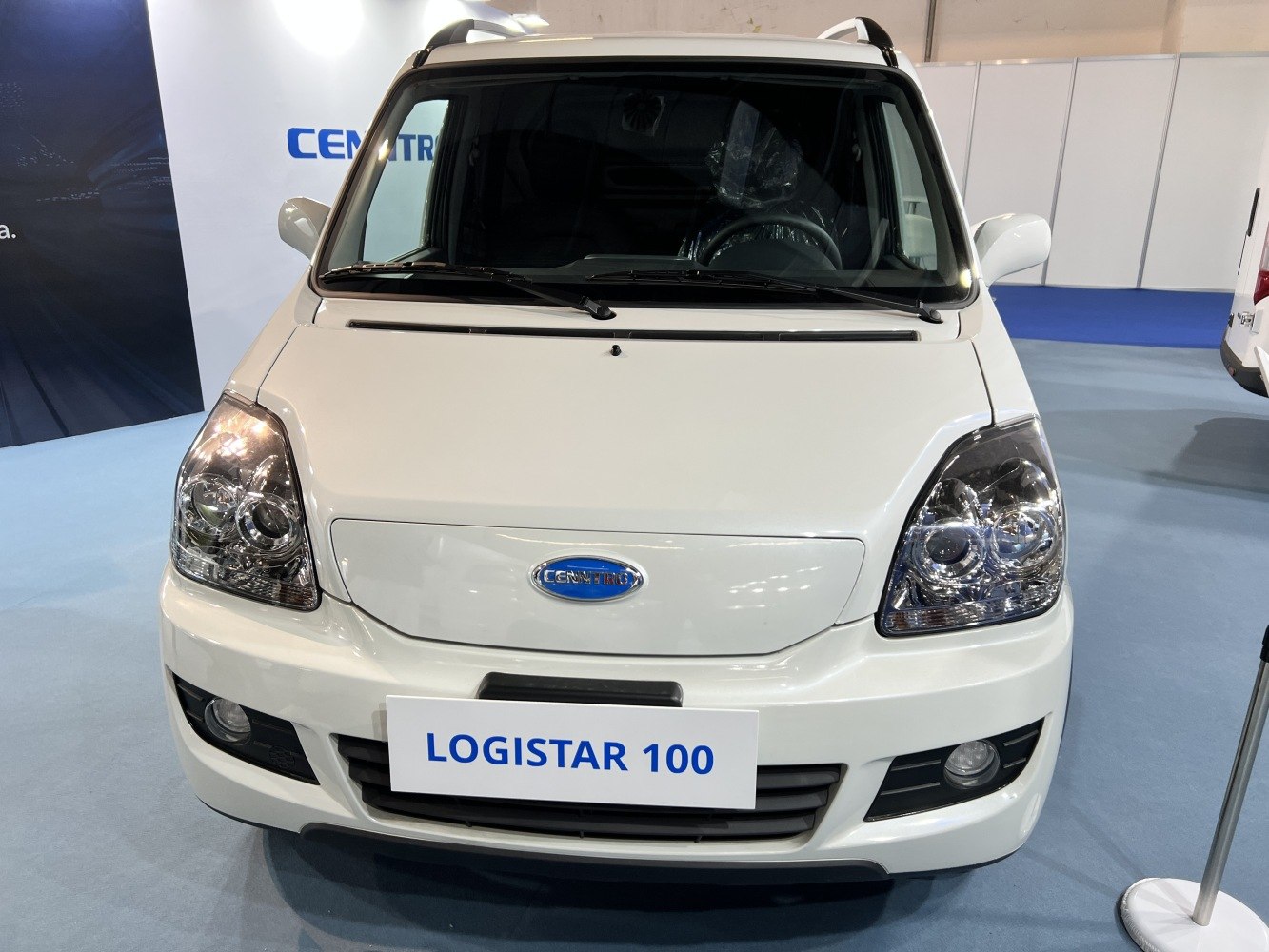 Front view with distinctive headlights and grille of an electric utility vehicle