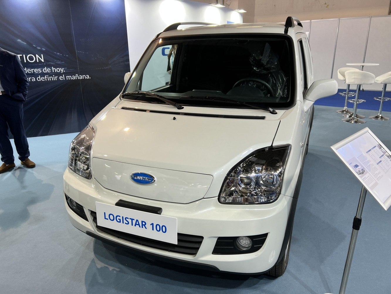 Front view of a compact electric vehicle with distinctive headlights and smooth grille