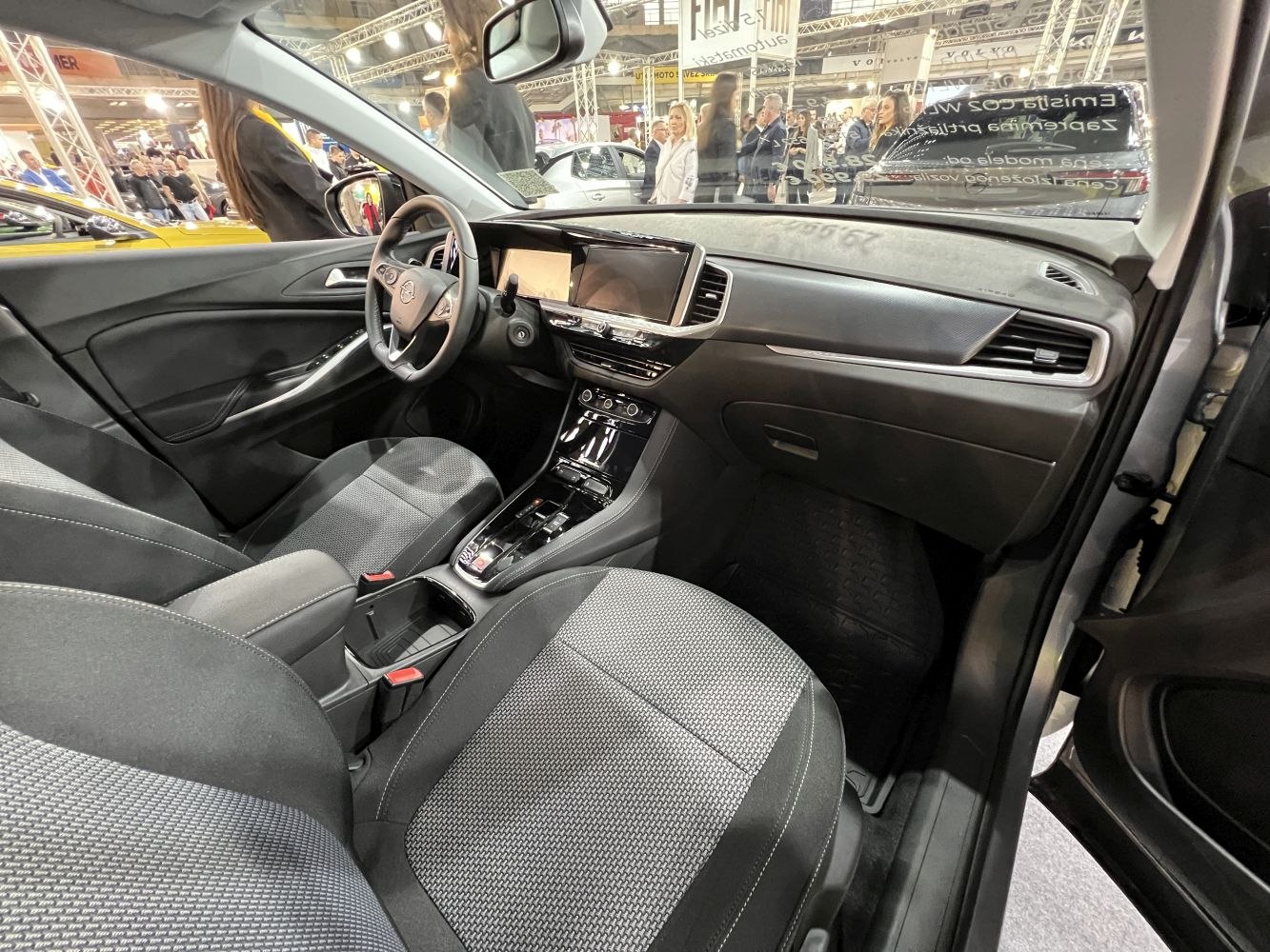 Modern interior with touchscreen, ergonomic seats, and spacious cabin layout