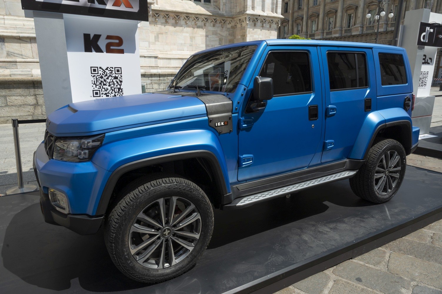 Rugged SUV with wide wheels, detailed headlights, and side steps