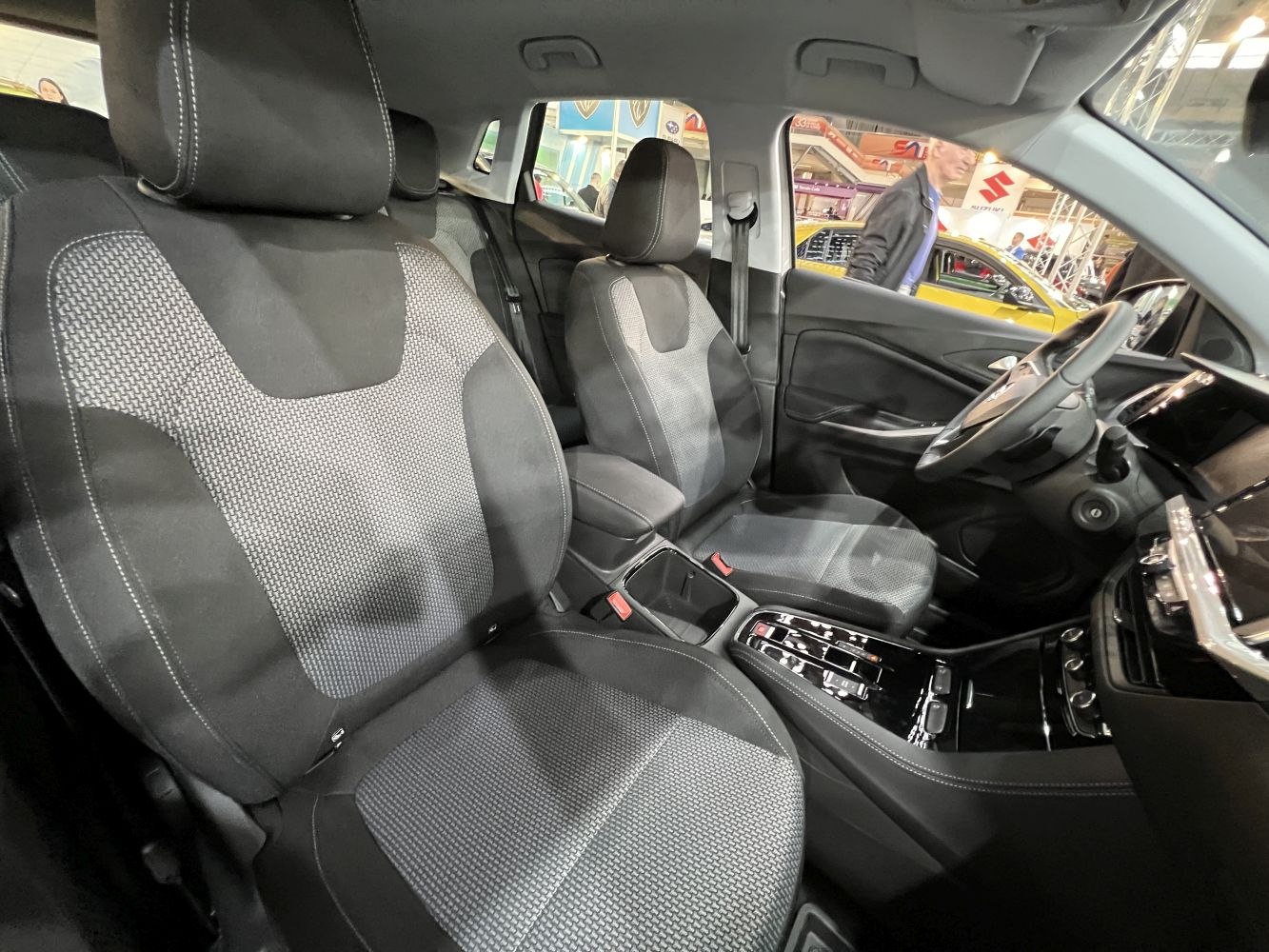 Front seats and dashboard interior with fabric upholstery and modern design