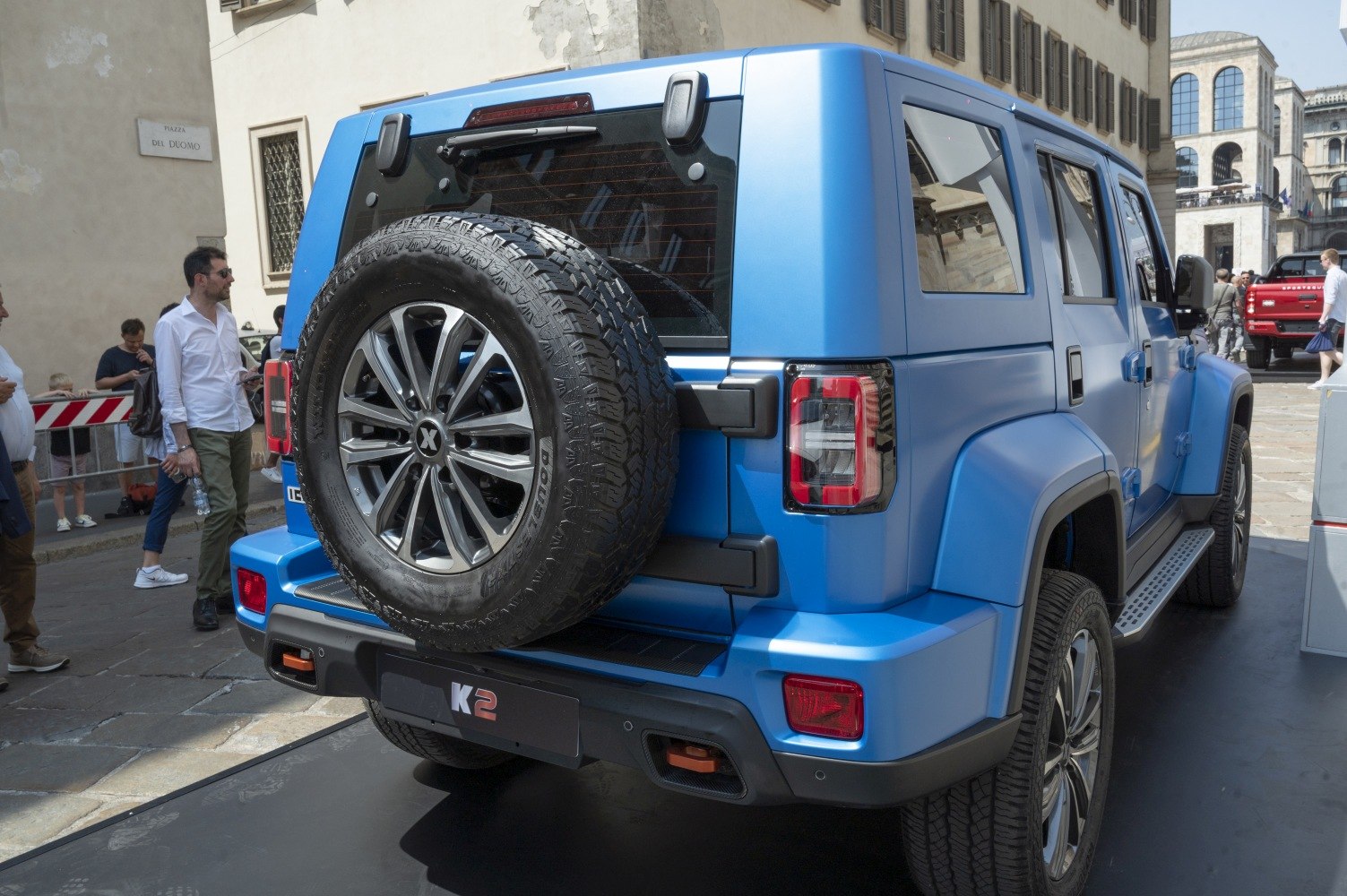 Rear view with mounted spare tire and LED tail lights on SUV