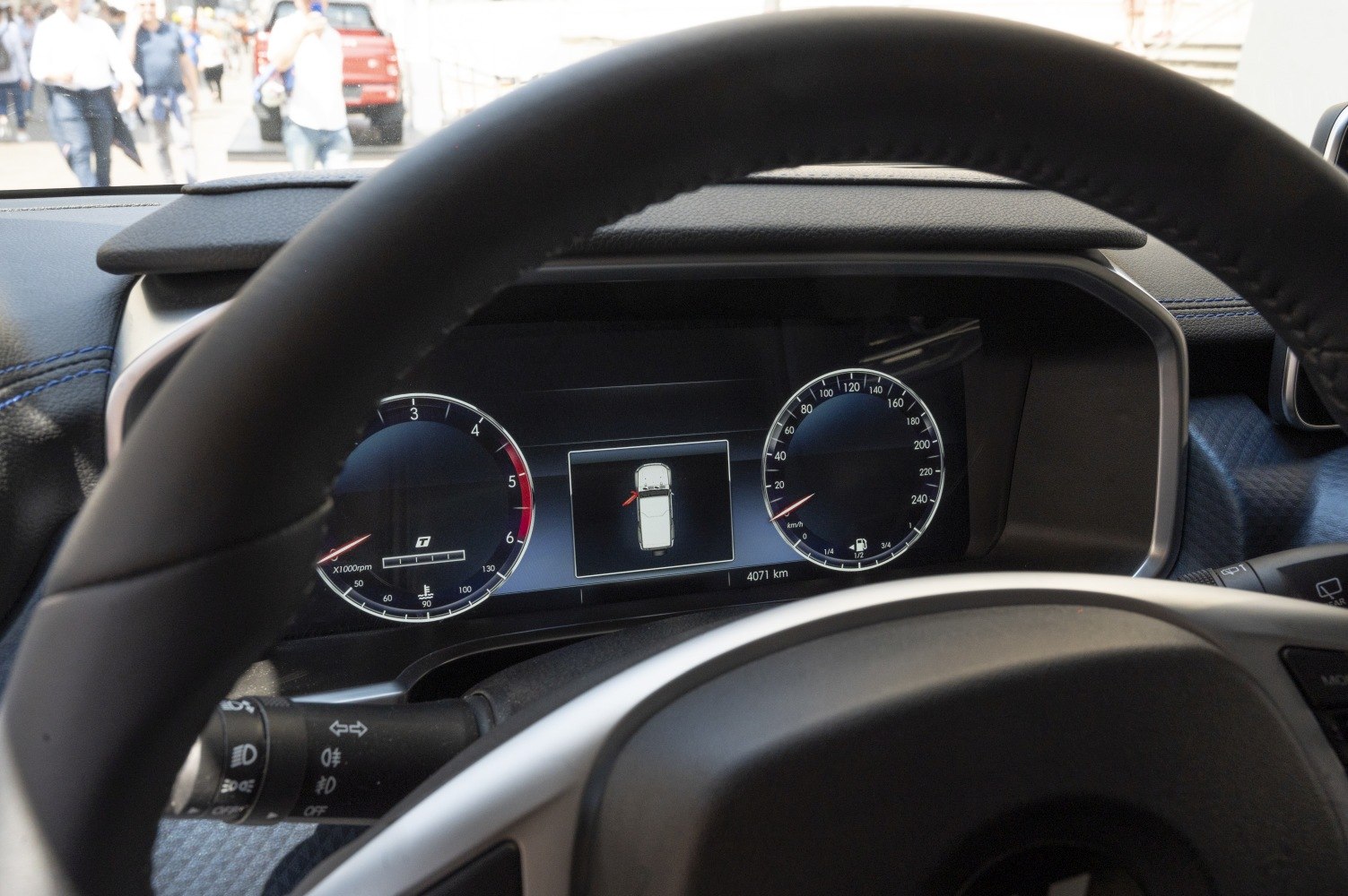 Digital instrument cluster with tachometer and speedometer gauges