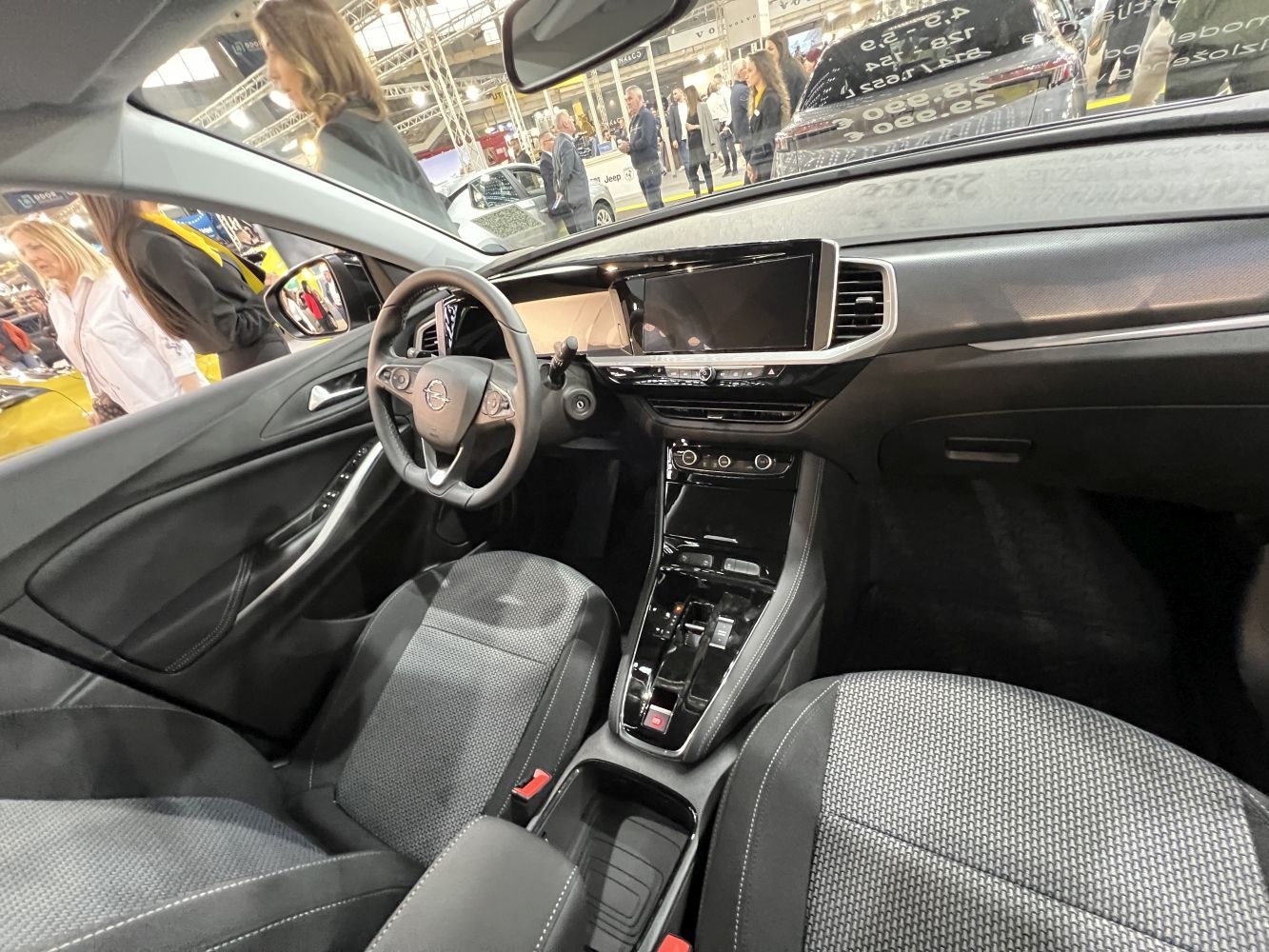 Digital dashboard, large infotainment screen, modern steering wheel