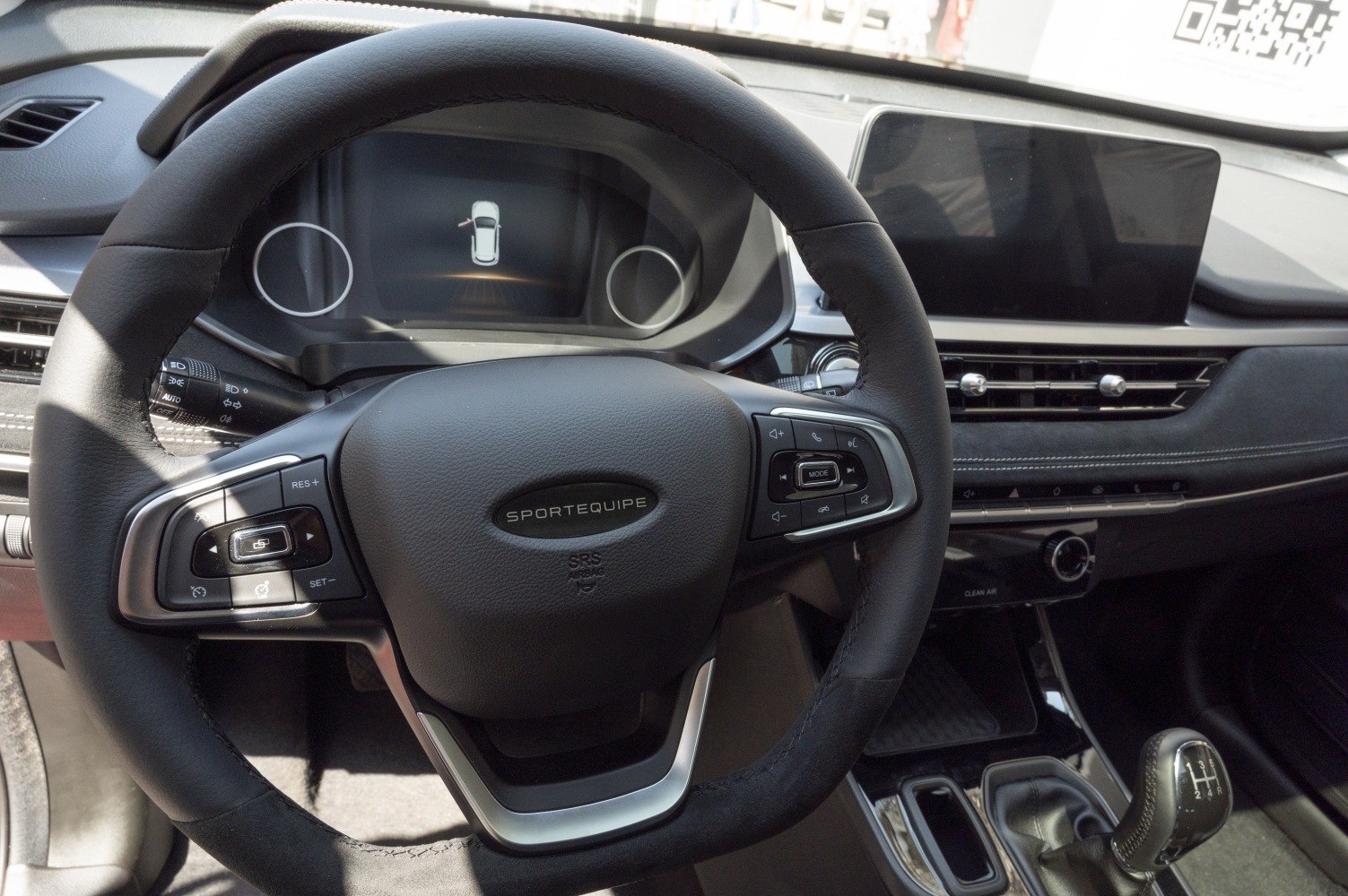 Modern steering wheel with digital dashboard and touchscreen infotainment