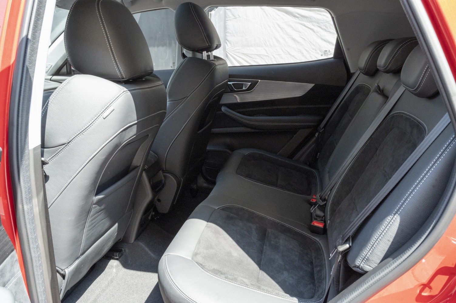Rear seat interior with leather upholstery and spacious design