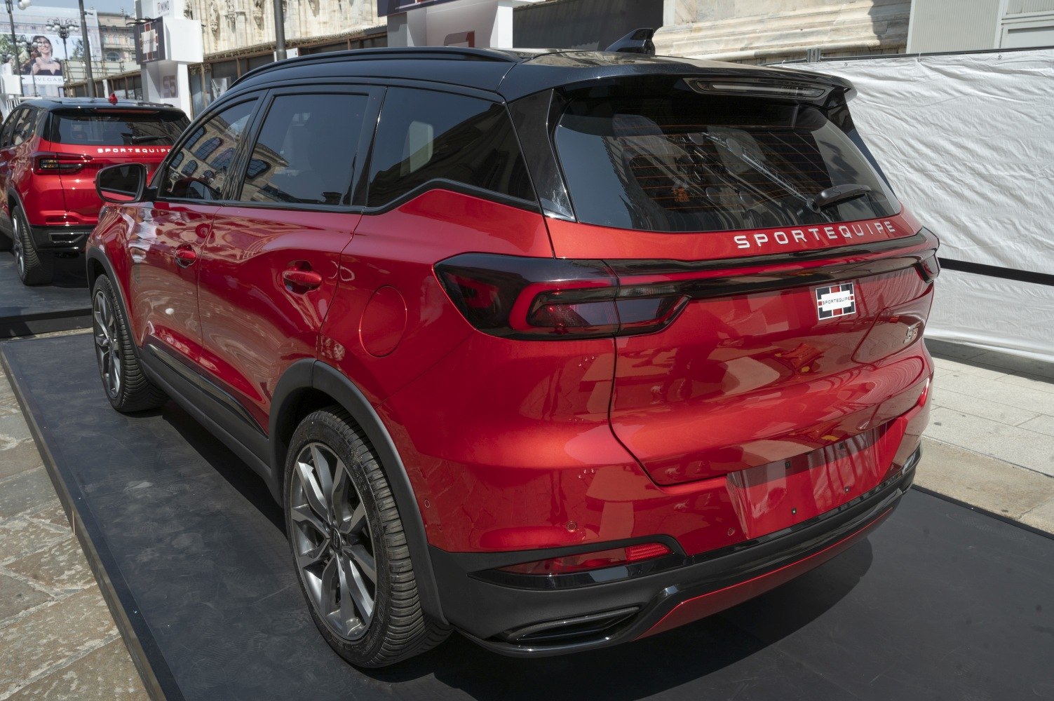 Red SUV with sleek rear lights and sporty design.