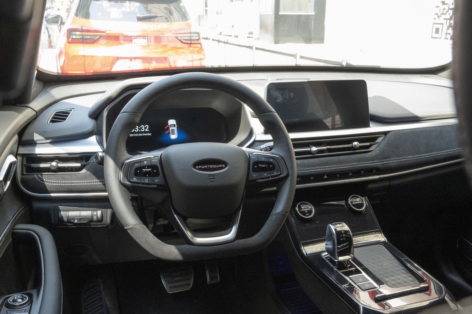 Digital instrument cluster and touchscreen infotainment center in modern car interior