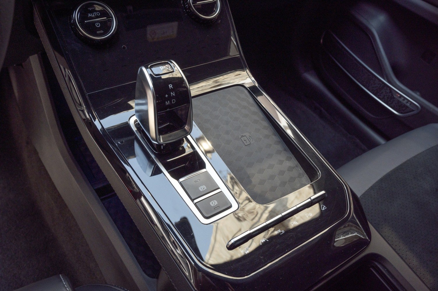 Gear shifter and center console with wireless charging pad