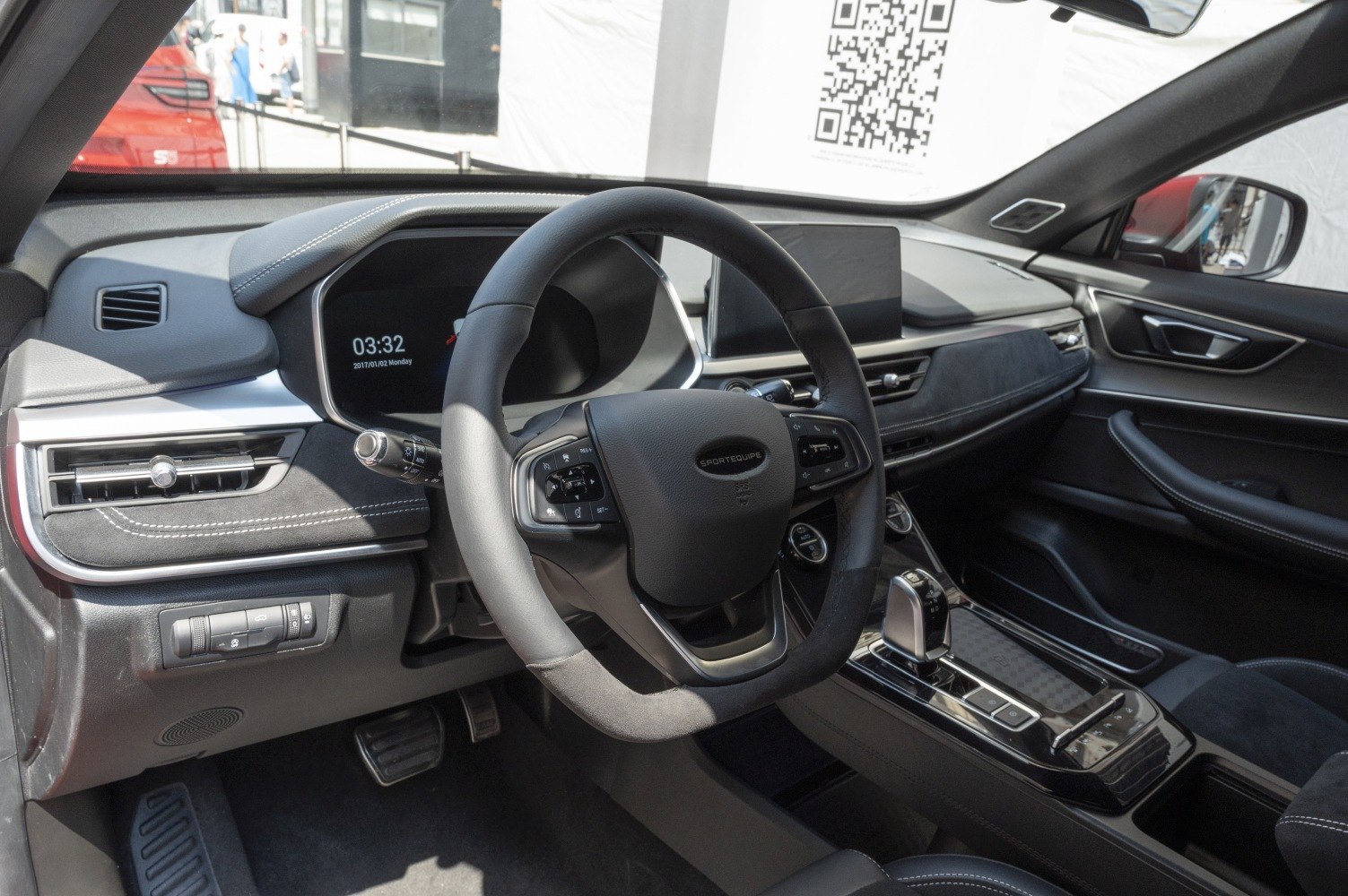 Modern steering wheel, digital instrument cluster, and center console dashboard
