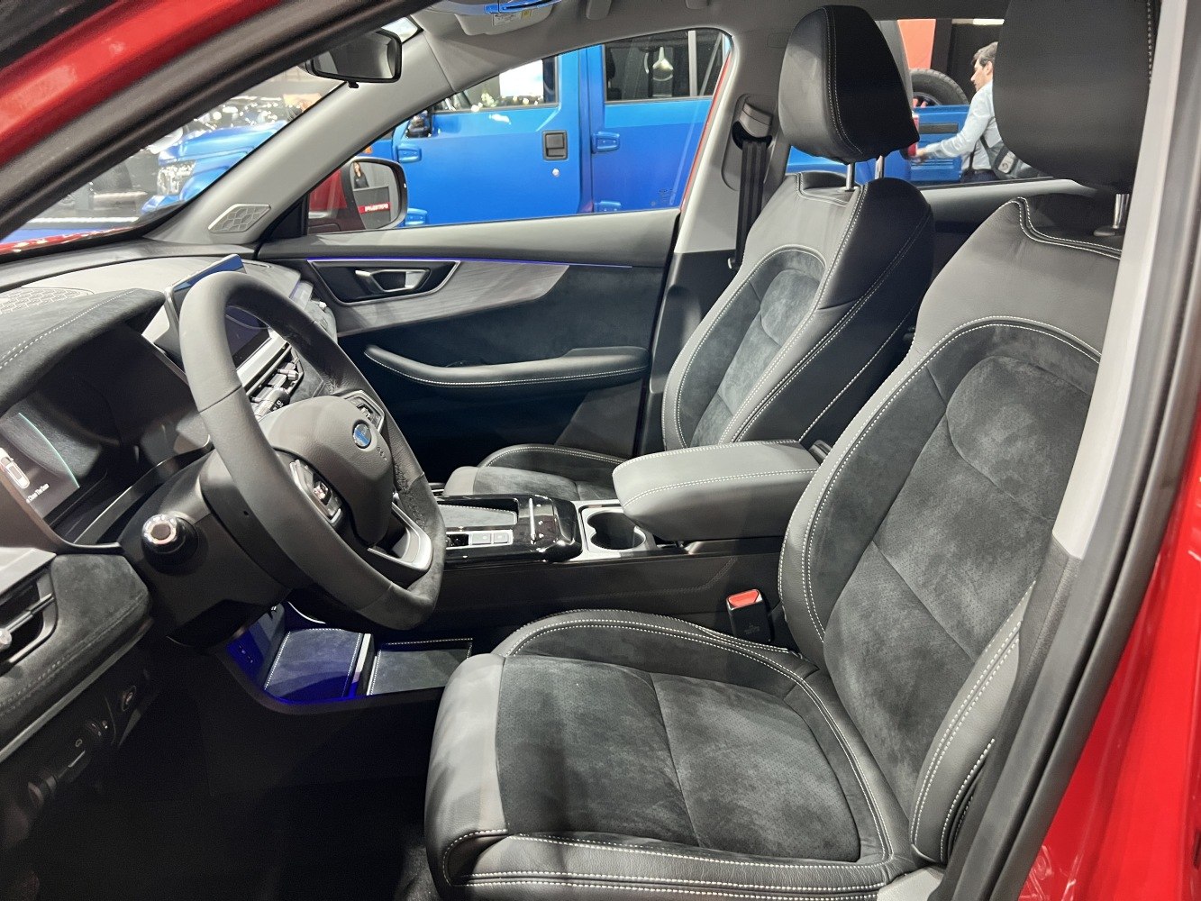 Luxury front seats and modern dashboard with steering wheel