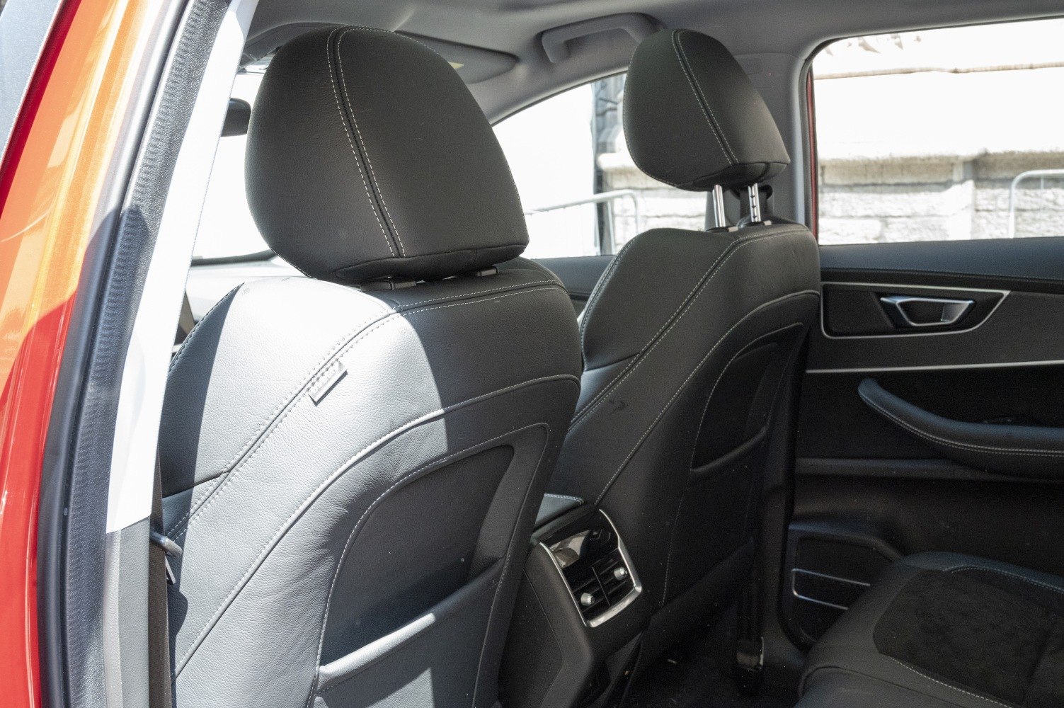 Leather rear seat backs with headrests and rear air vents.