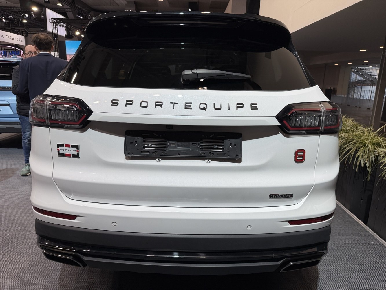 Hybrid SUV rear with modern taillights and distinct emblems