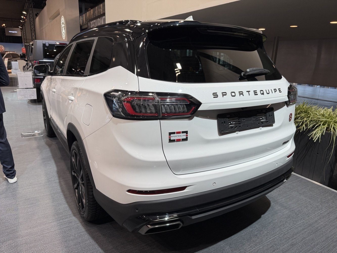 SUV rear design with modern taillights and roof spoiler