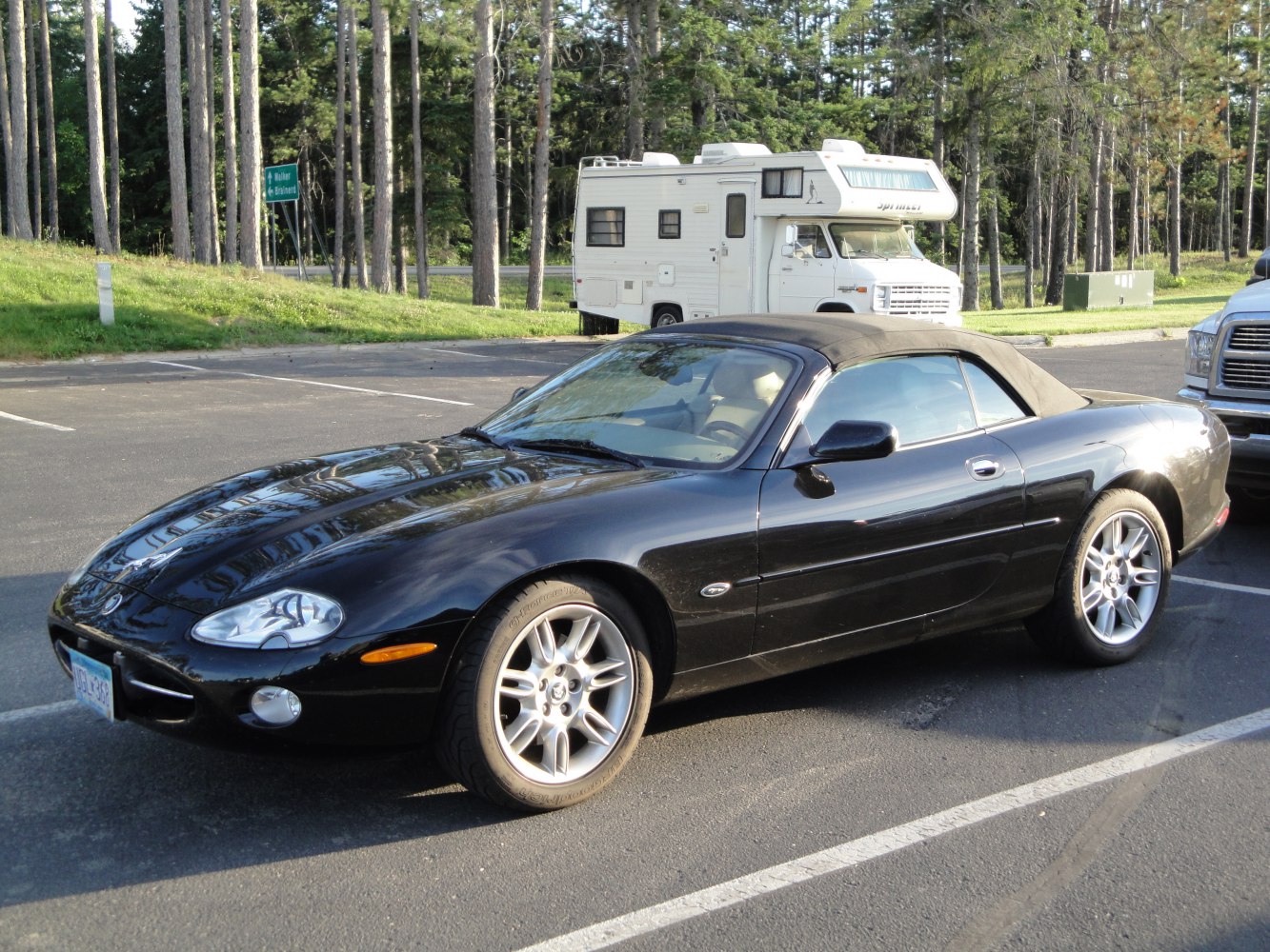 Black convertible with soft top and elegant alloy wheels