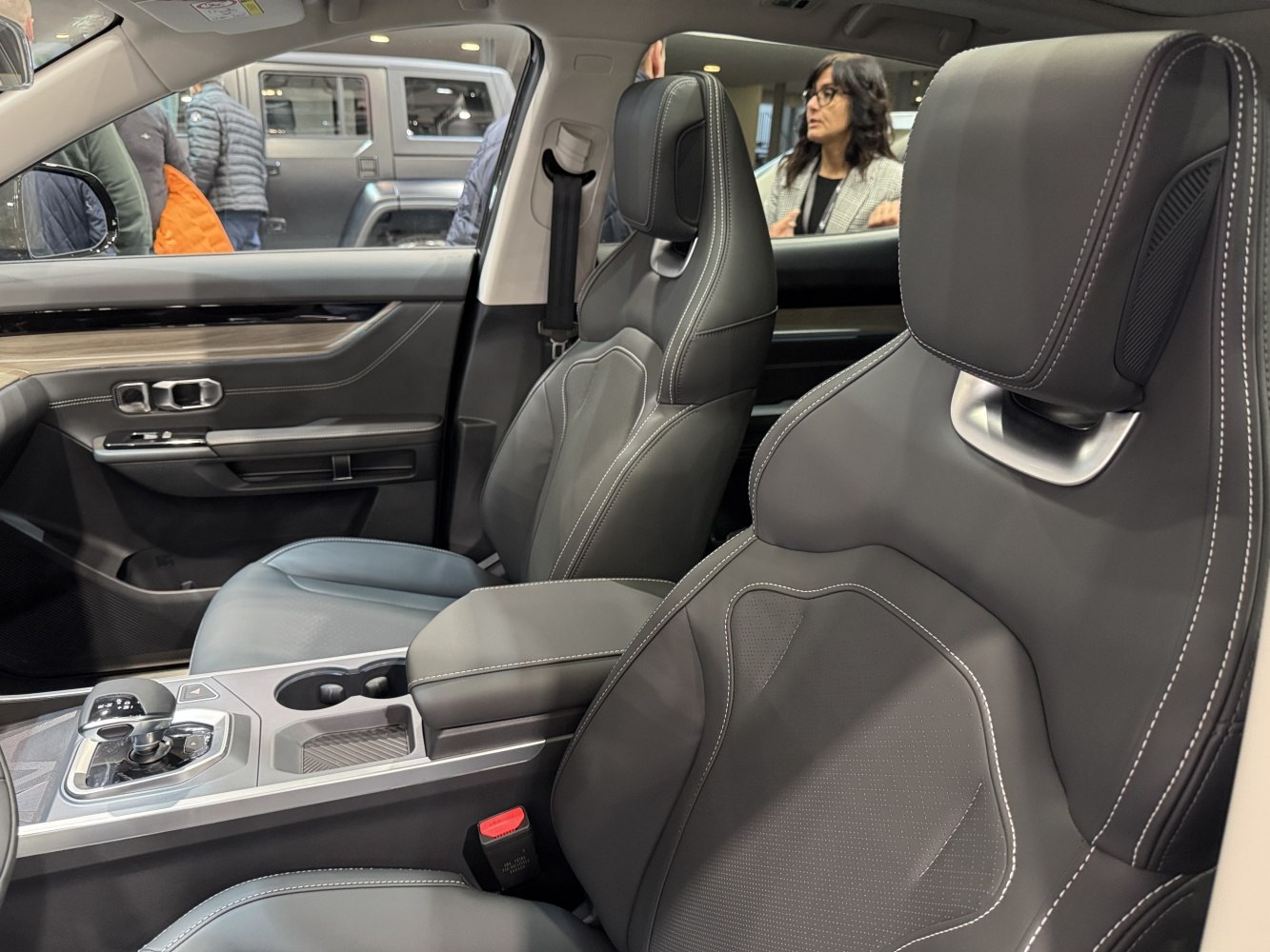 Premium stitched car seats with modern center console and gear shifter