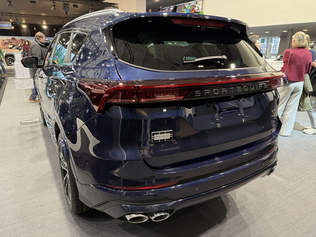 Rear design with LED tail lights, dual exhaust, and spoiler