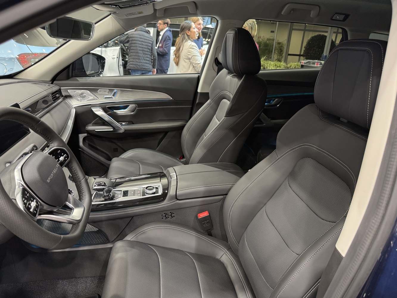 Leather front seats and modern center console with advanced controls